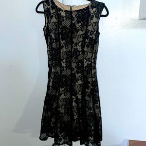 Woman’s Level Eight double layered black knit dress. With floral pattern.size M
